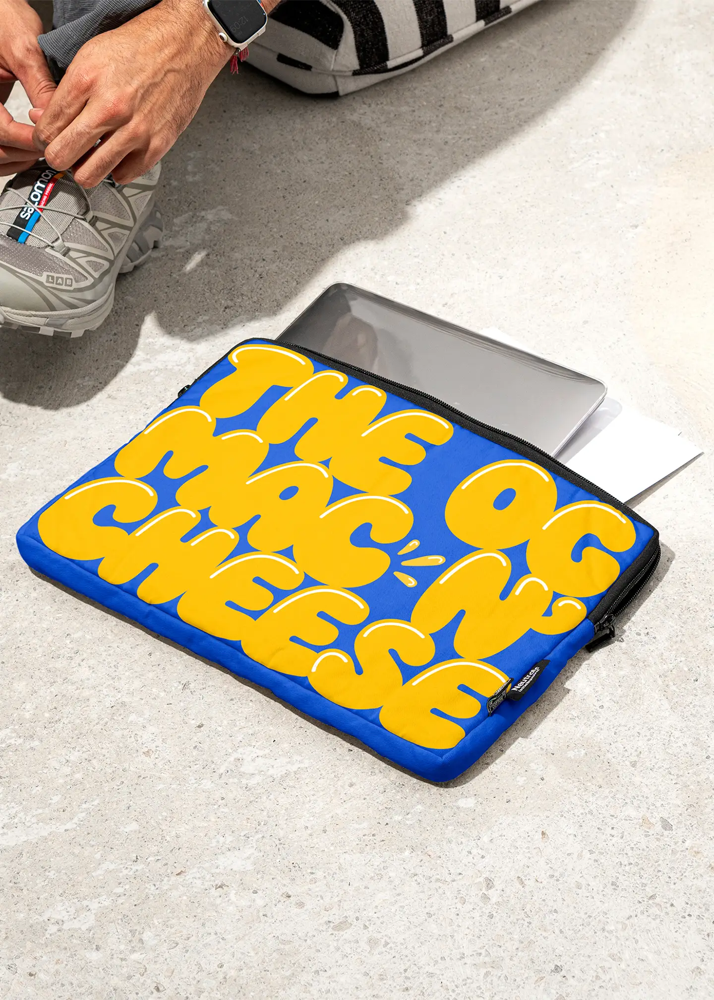 blue laptop case with the OG mac n' cheese written on it