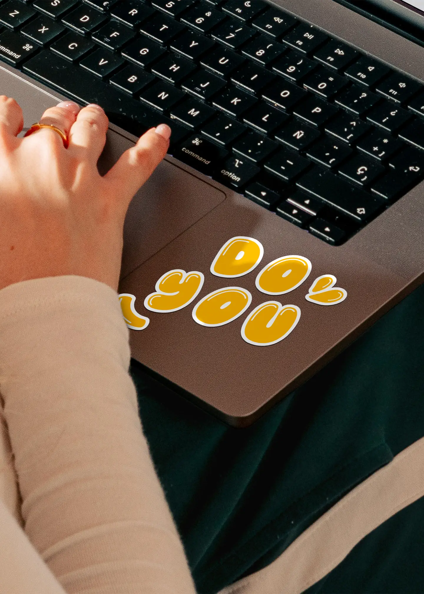 sticker saying do you on laptop