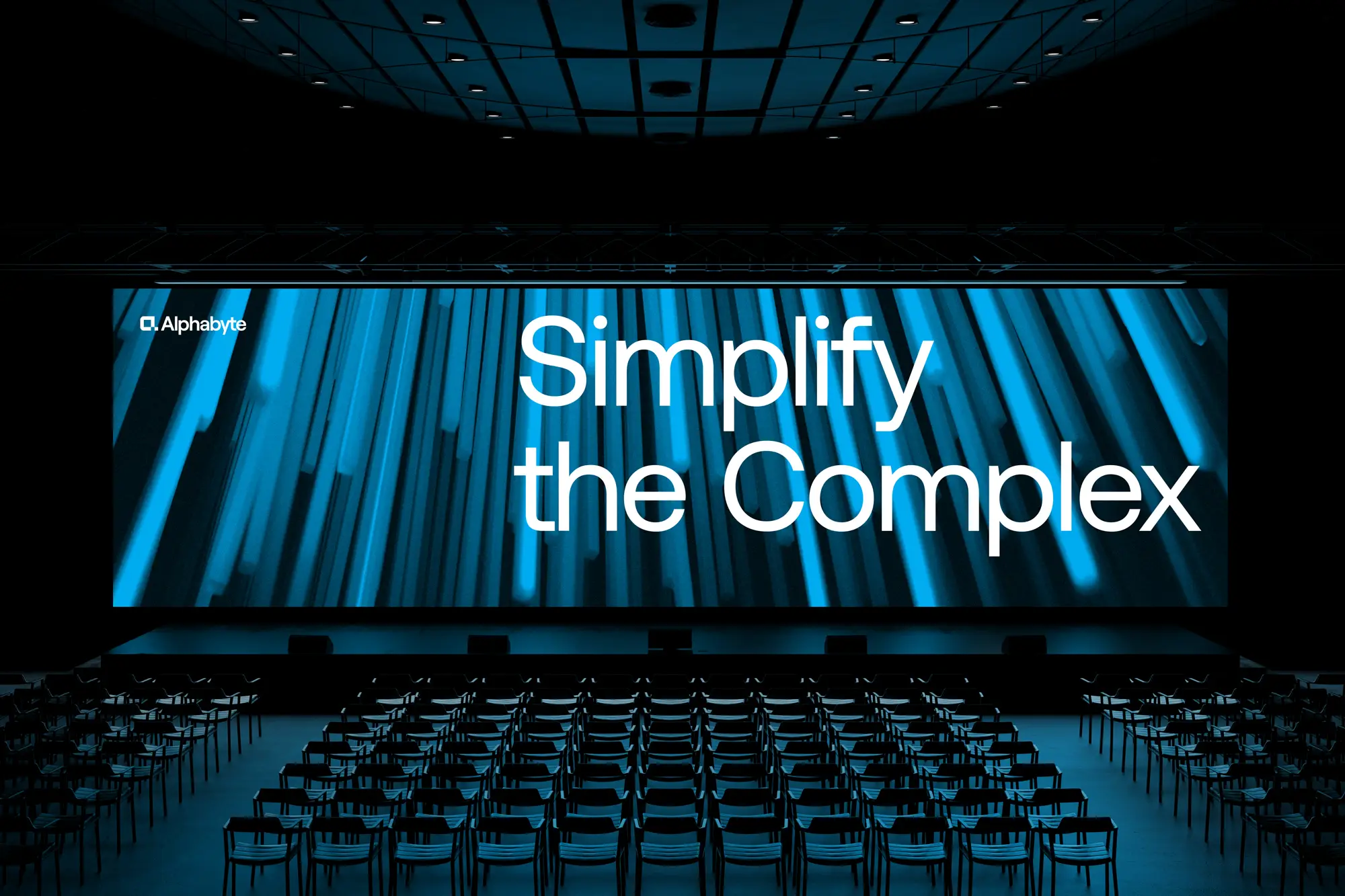 large indoor venue with alphabyte branded image on screen