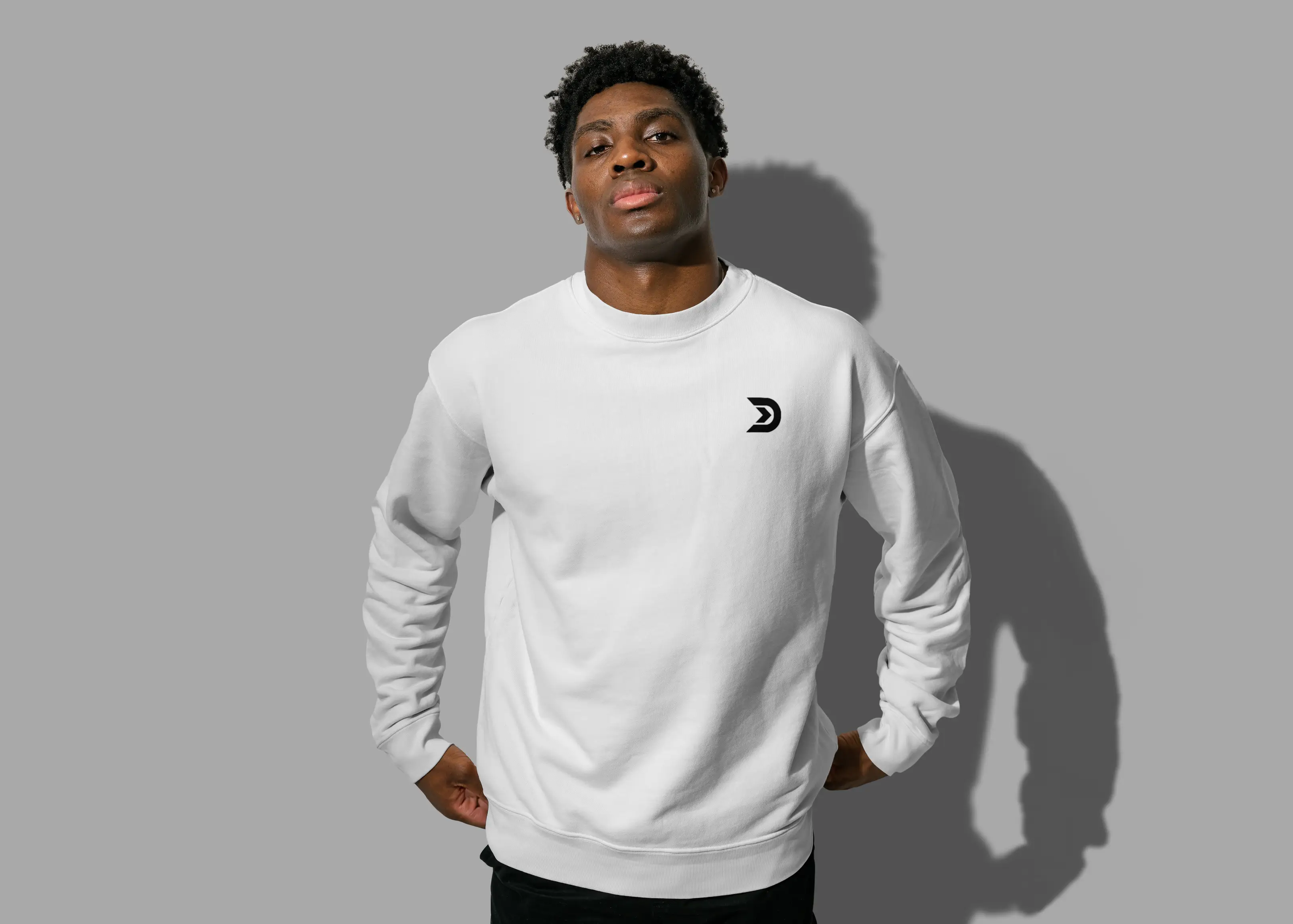 D logo icon on white sweatshirt