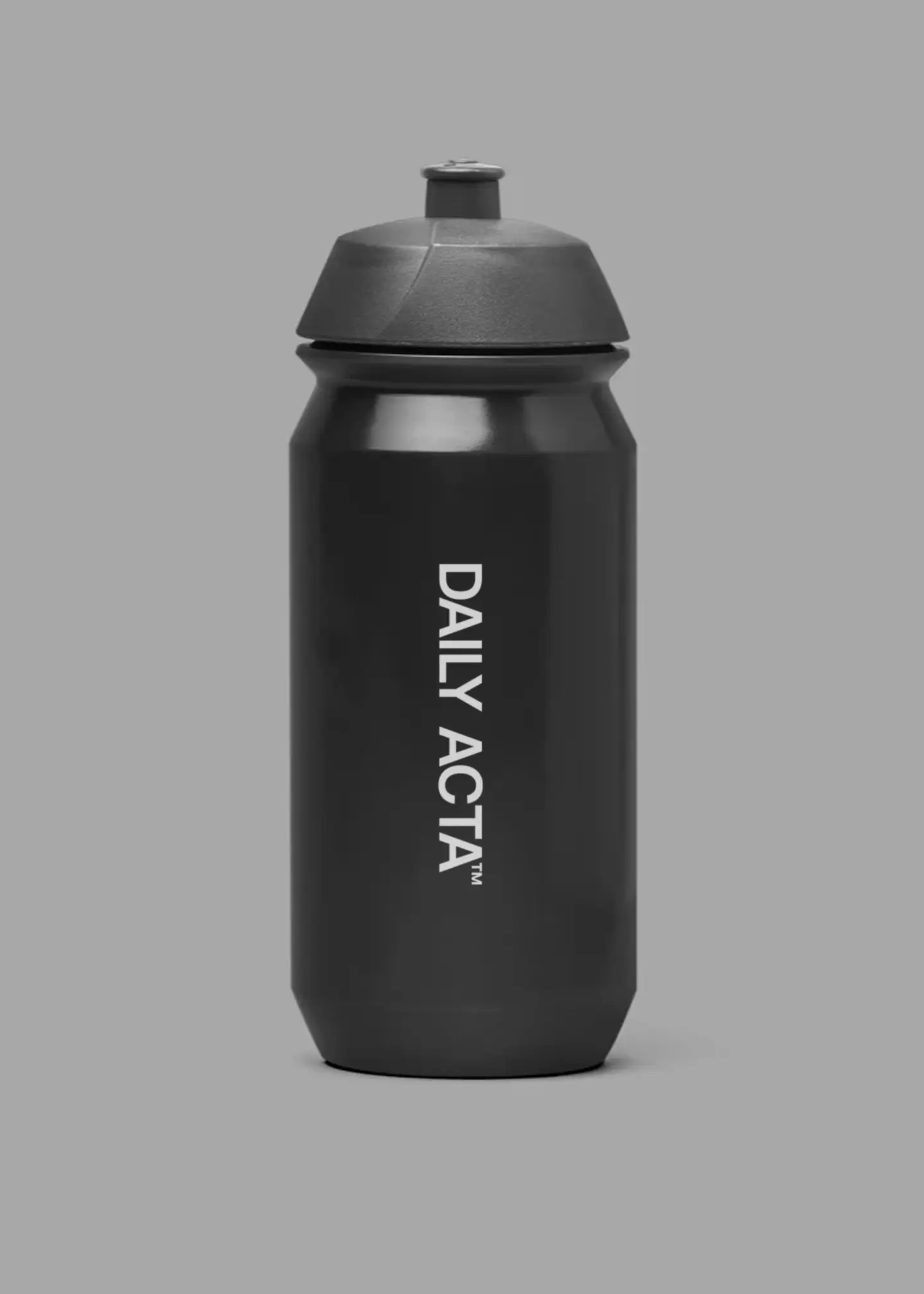 black water bottle infront of grey background
