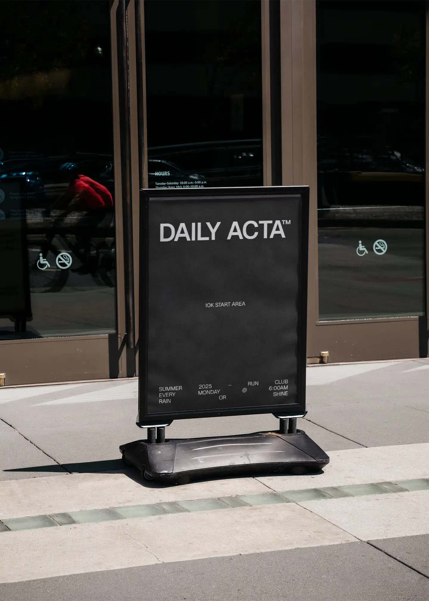  black daily acta running group sign outdoors