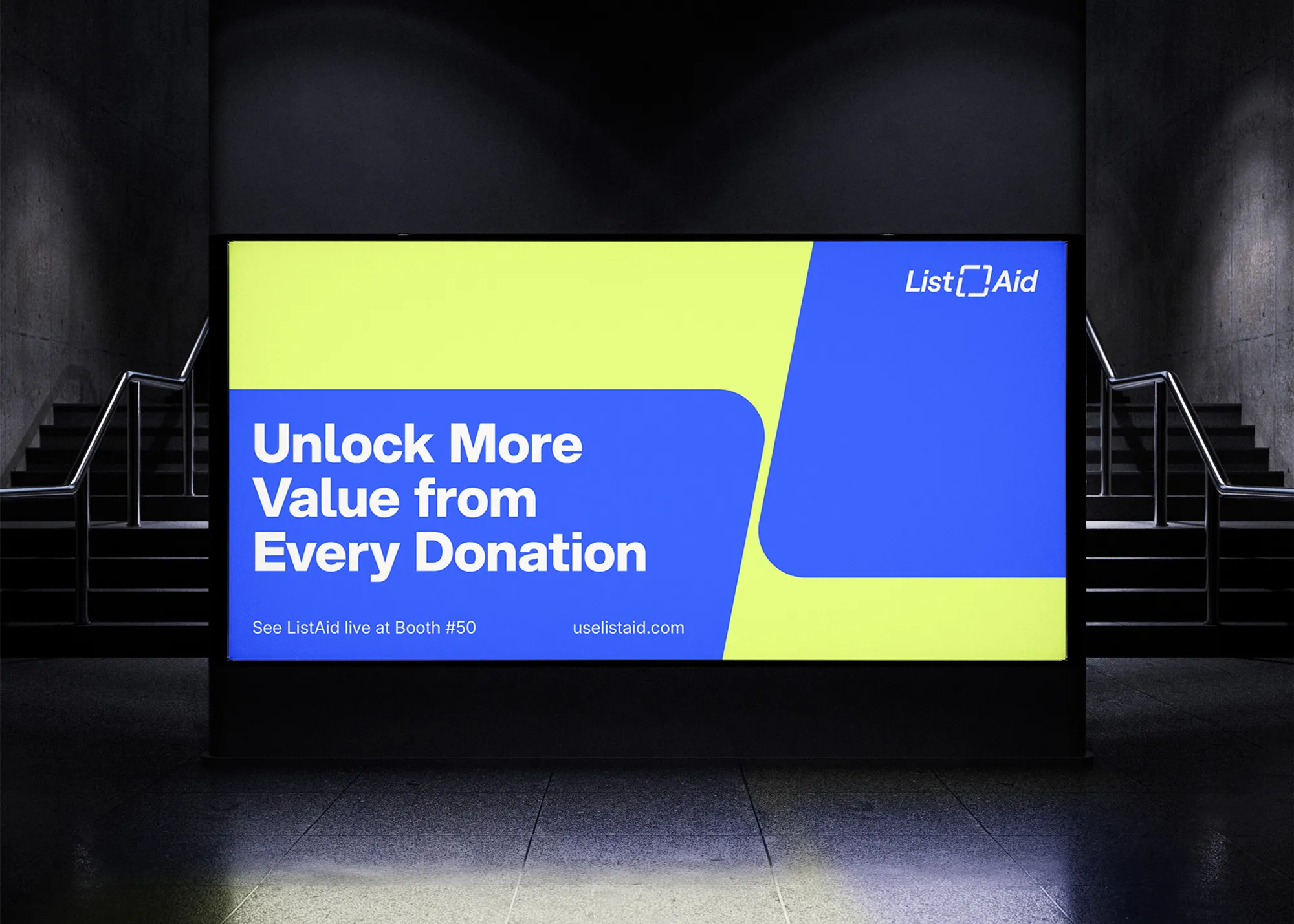 horizontal ad on wall inside underground next to staircase