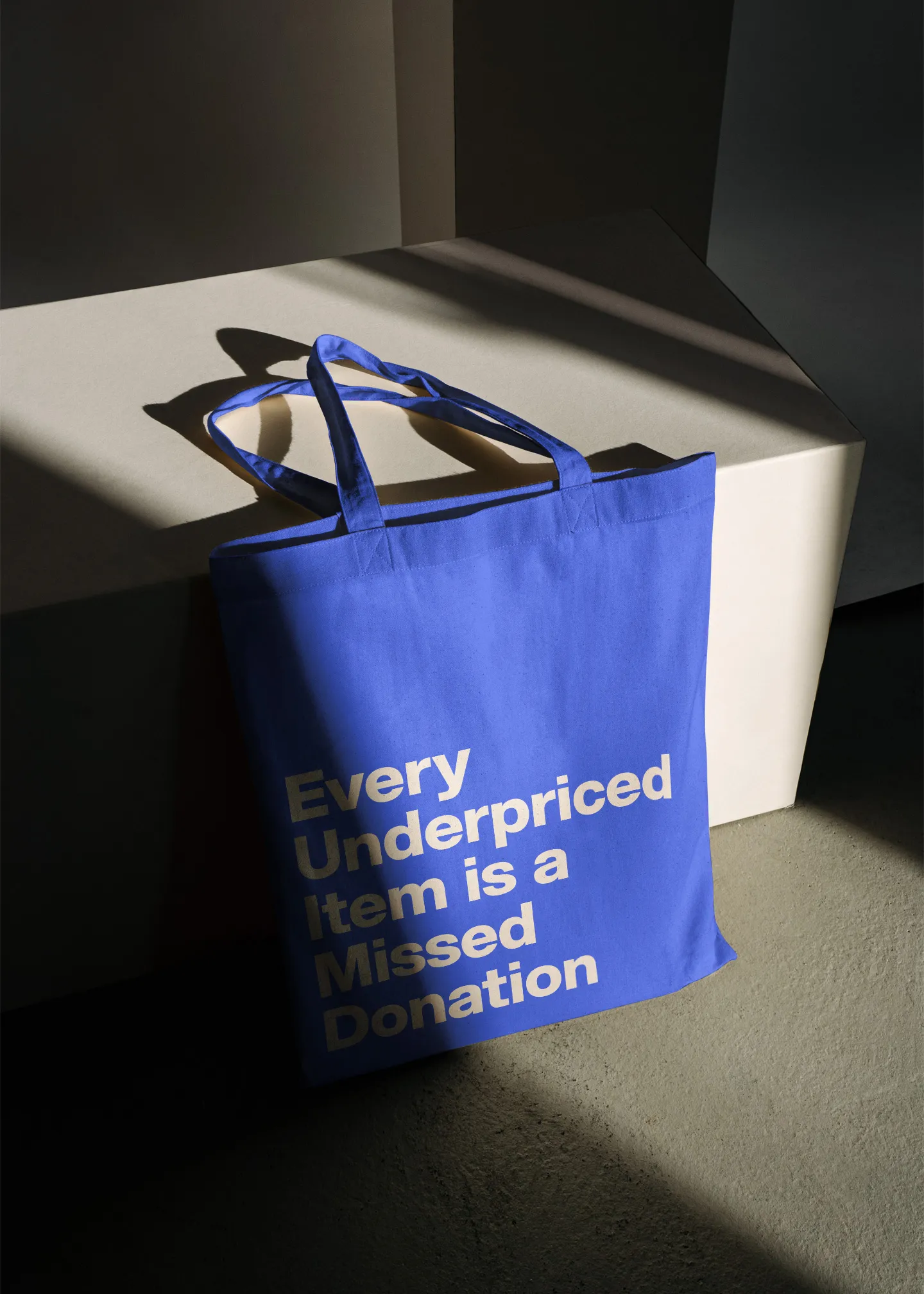 listaid blue tote back sitting on floor