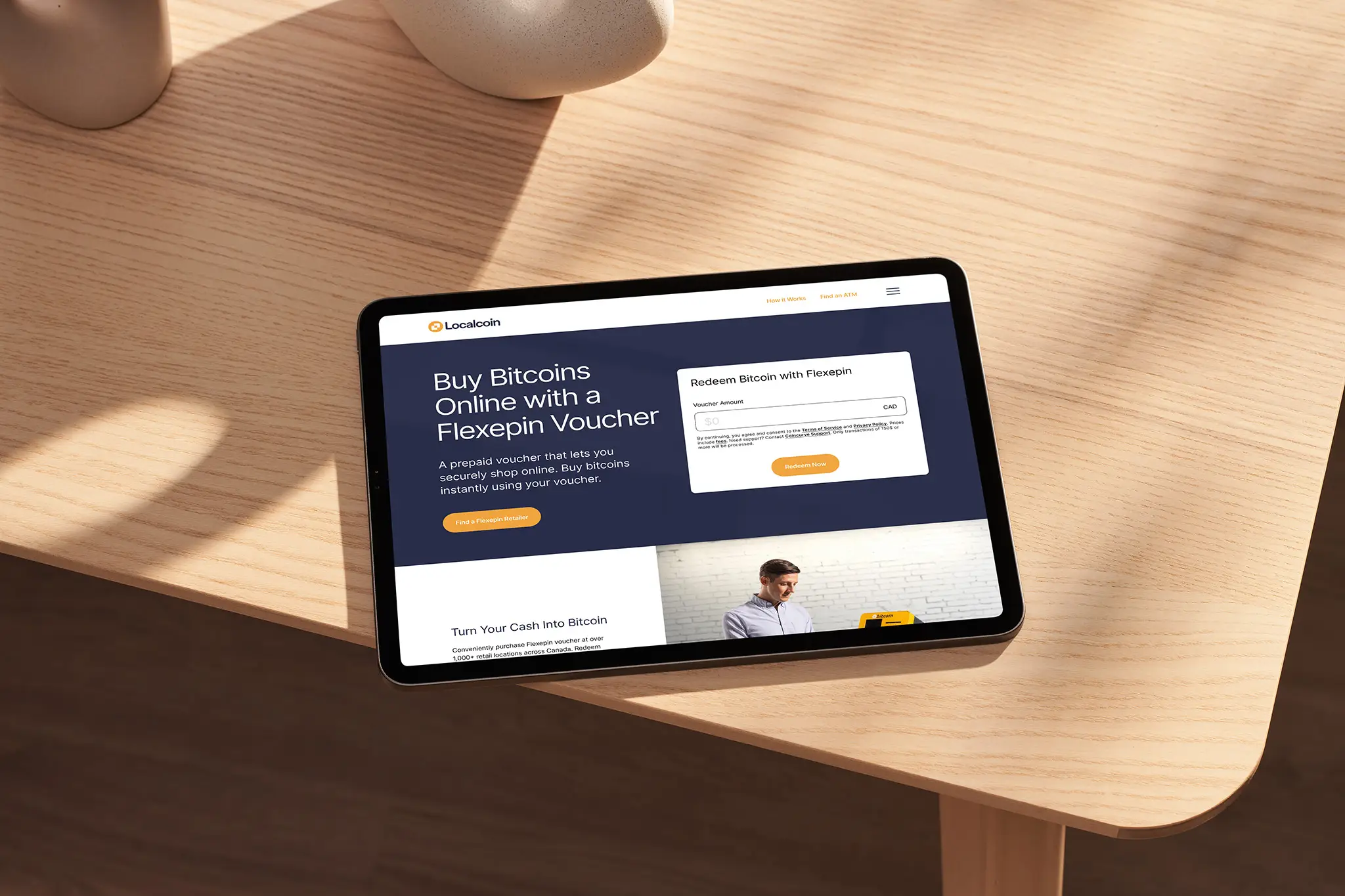 ipad sitting on table with localcoin website