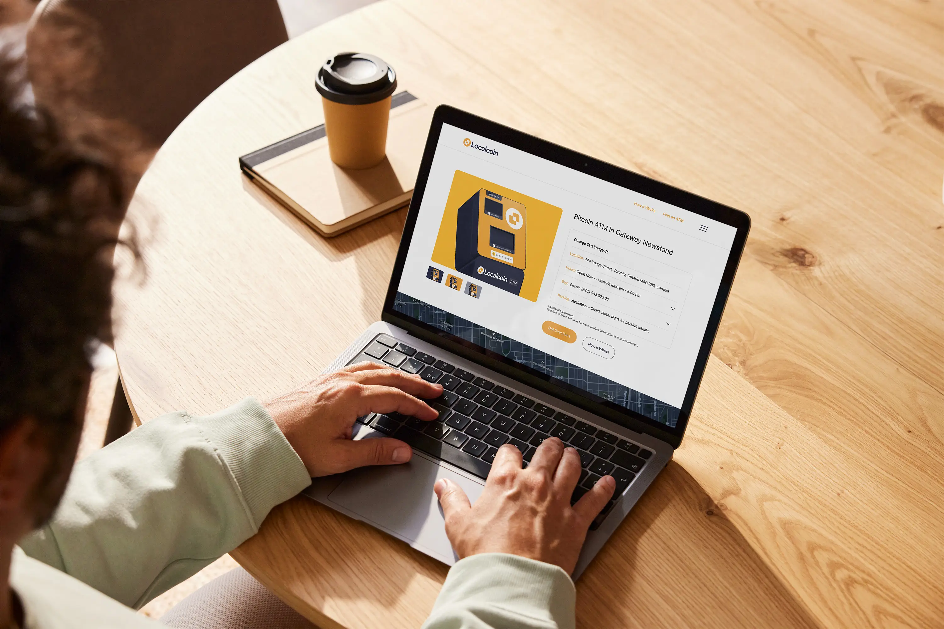 guy sitting at table on laptop, showing localcoing website