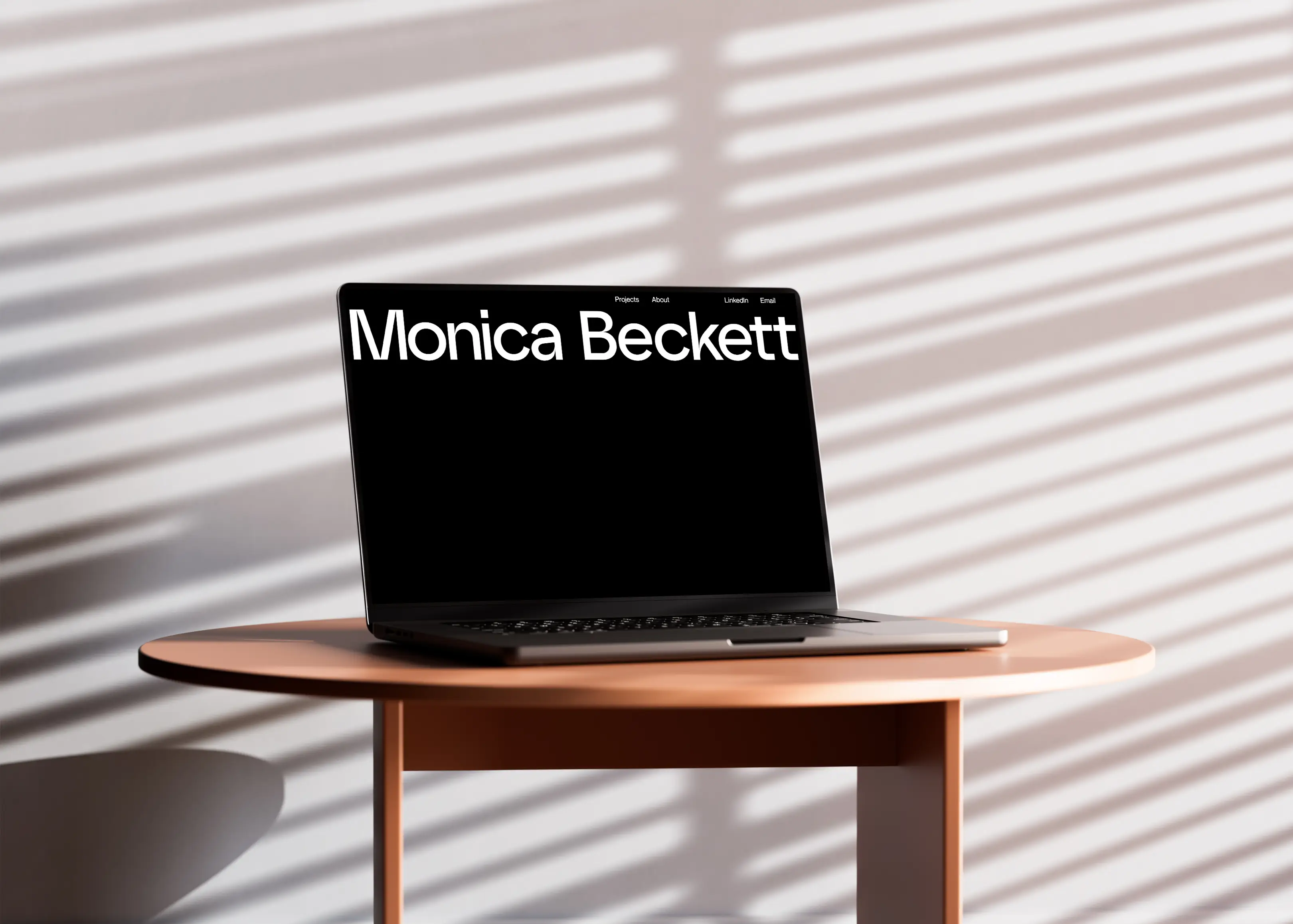 laptop on table showing website home screen