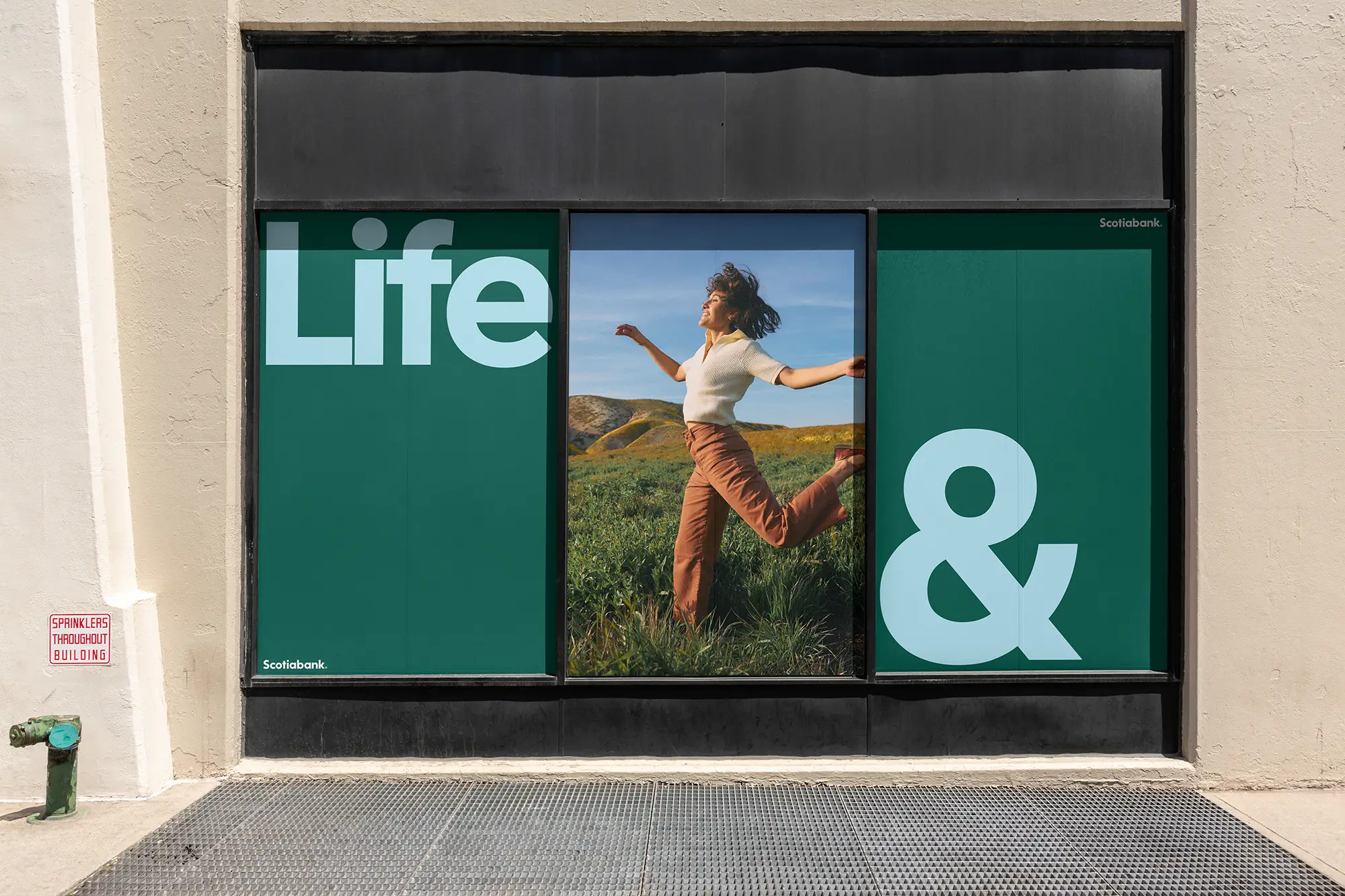 three posters on the side of a building